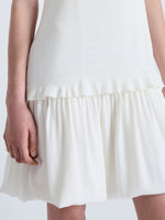 Detail image of model wearing Martine Dress in Micro Pleat in OFF WHITE