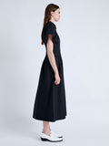 Side full length image of model wearing Balston Dress in Poplin in BLACK