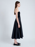 Side full length image of model wearing Warren Dress in Tech Poplin in BLACK