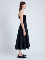 Side full length image of model wearing Warren Dress in Tech Poplin in BLACK