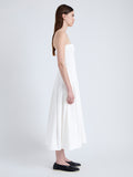 Side full length image of model wearing Warren Dress in Tech Poplin in WHITE