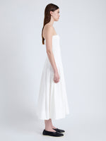 Side full length image of model wearing Warren Dress in Tech Poplin in WHITE