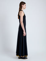 Side full length image of model wearing Rey Dress in Jersey in BLACK