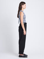 Side full length image of model wearing Birdie Top in Grid Poplin in NAVY/OFF WHITE