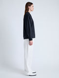 Side full length image of model wearing Carter Top in Tech Poplin in BLACK