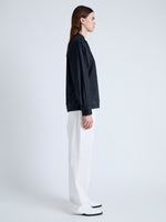 Side full length image of model wearing Carter Top in Tech Poplin in BLACK