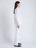 Side full length image of model wearing Carter Top in Tech Poplin in WHITE