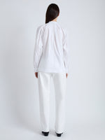 Back full length image of model wearing Carter Top in Tech Poplin in WHITE