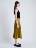 Side full length image of model wearing Daphne Skirt in Faux Leather in CHAI