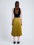 Back full length image of model wearing Daphne Skirt in Faux Leather in CHAI