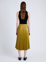 Back full length image of model wearing Daphne Skirt in Faux Leather in CHAI