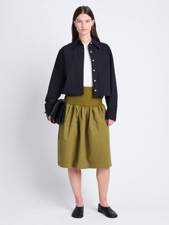 Front image of model wearing Olive Skirt in Peached Poplin in OLIVE