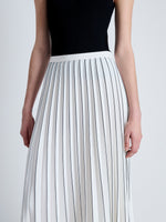 Detail image of model wearing Pleated Miles Skirt in Crepe in WHITE/BLACK