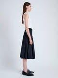 Side full length image of model wearing Peters Skirt in Tech Poplin in BLACK