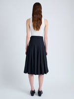 Back full length image of model wearing Peters Skirt in Tech Poplin in BLACK