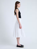 Side full length image of model wearing Peters Skirt in Tech Poplin in WHITE