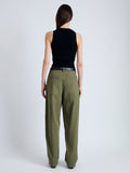 Back image of model wearing Sydnor Pants in Rumpled Cotton in Dark Olive