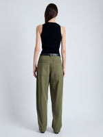 Back image of model wearing Sydnor Pants in Rumpled Cotton in Dark Olive