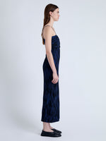 Side full length image of model wearing Ward Knit Dress in Printed Rib in NAVY/BLACK