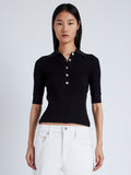 Front cropped image of model wearing Cooper Knit Polo in Micro Cable in BLACK