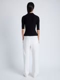 Back image of model wearing Cooper Knit Polo in Micro Cable in BLACK