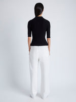 Back image of model wearing Cooper Knit Polo in Micro Cable in BLACK