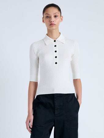 Front cropped image of model wearing Cooper Knit Polo in Micro Cable in OFF WHITE