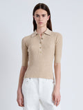 Front cropped image of model wearing Cooper Knit Polo in Micro Cable in CASHEW