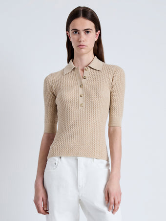 Front cropped image of model wearing Cooper Knit Polo in Micro Cable in CASHEW