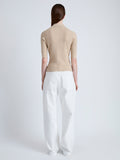 Back full length image of model wearing Cooper Knit Polo in Micro Cable in CASHEW