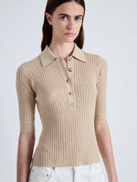 Detail image of model wearing Cooper Knit Polo in Micro Cable in CASHEW