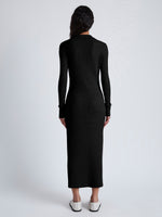 Back image of model wearing Phillips Knit Dress in Micro Cable in black