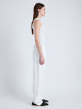 Side full length image of model wearing Perry Knit Top in Compact Pointelle Rib in OFF WHITE