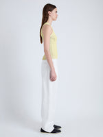 Side image of model wearing Perry Knit Top in Compact Pointelle Rib in pale yellow