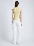 Back image of model wearing Perry Knit Top in Compact Pointelle Rib in pale yellow