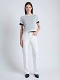 Front full length image of model wearing Powell Sheer Knit Top in OFF WHITE/BLACK