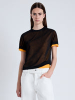 Front cropped image of model wearing Powell Sheer Knit Top in BLACK/MARIGOLD