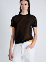 Detail image of model wearing Powell Sheer Knit Top in BLACK/MARIGOLD