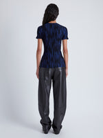 Back image of model wearing Foster Knit Top in Printed Rib in navy/black