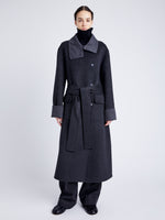 Proenza Schouler Front full length image of model wearing Constance Coat in Pinstripe Wool Cashmere in DARK GREY MELANGE buttoned with coat belt