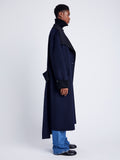 Proenza Schouler Side full length image of model wearing Constance Coat in Pinstripe Wool Cashmere in NAVY MELANGE