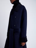 Proenza Schouler Detail image of model wearing Constance Coat in Pinstripe Wool Cashmere in NAVY MELANGE