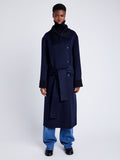 Proenza Schouler Front full length image of model wearing Constance Coat in Pinstripe Wool Cashmere in NAVY MELANGE with coat belt