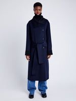 Proenza Schouler Front full length image of model wearing Constance Coat in Pinstripe Wool Cashmere in NAVY MELANGE with coat belt