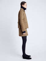 Proenza Schouler Side full length image of model wearing Sawyer Jacket in Gabardine in DARK BIRCH