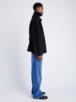 Proenza Schouler side image of model wearing Poppy Jacket in Pinstripe Melton in black/navy