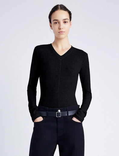 Proenza Schouler cropped front image of model wearing Delaney Bodysuit in Brushed Rib in black