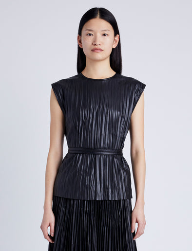 Proenza Schouler Front cropped image of model wearing Lyra Pleated Top in Lightweight Faux Leather in BLACK