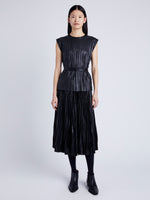 Proenza Schouler Front full length image of model wearing Lyra Pleated Top in Lightweight Faux Leather in BLACK