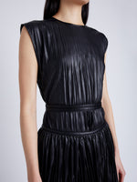 Proenza Schouler Detail image of model wearing Lyra Pleated Top in Lightweight Faux Leather in BLACK